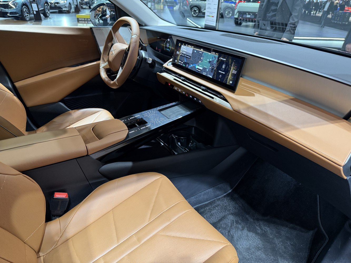 Digital dashboard with tan leather seats and modern control panel