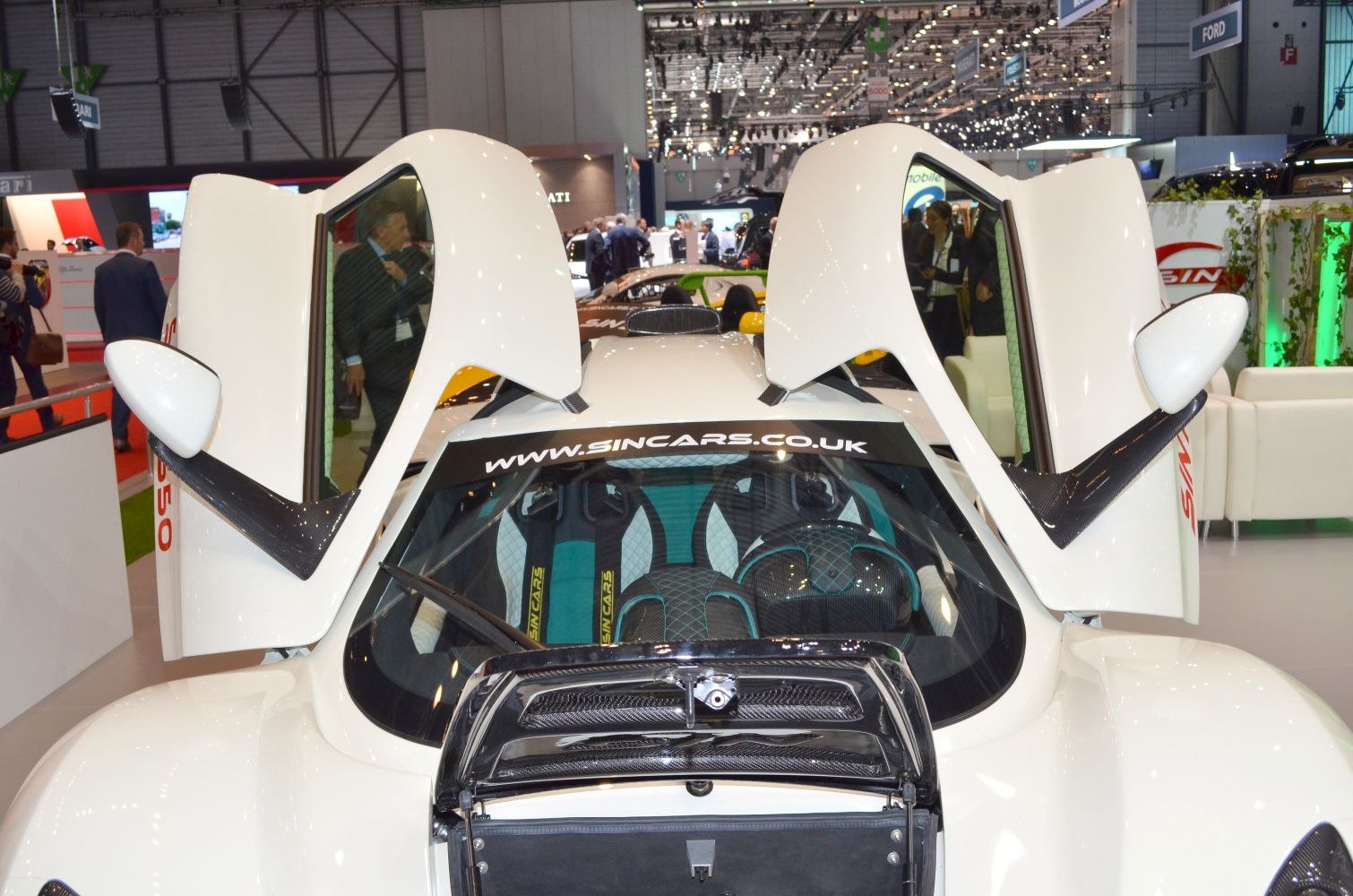 Butterfly doors and carbon fiber rear spoiler of a sports car