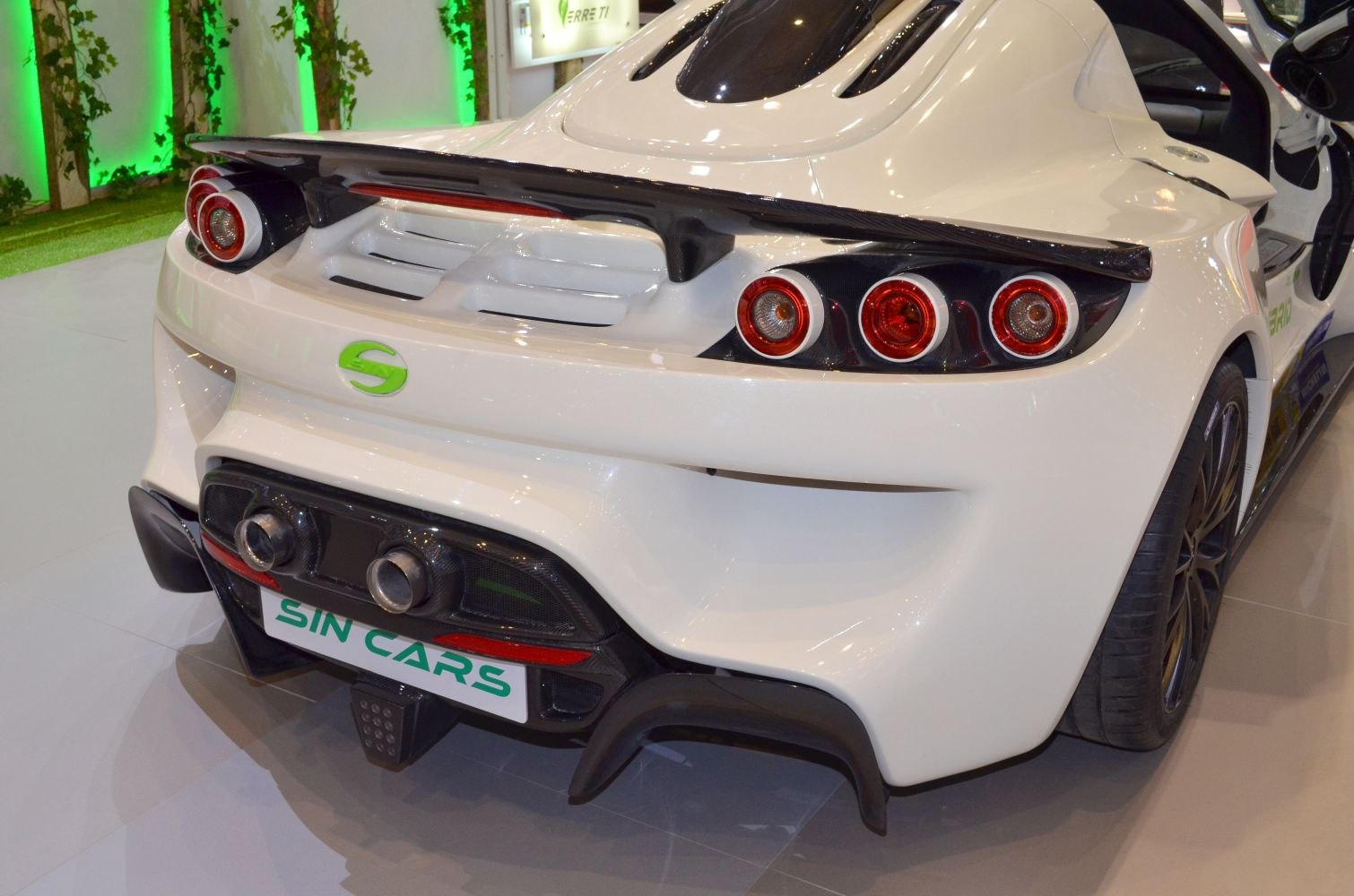 Rear view with quad round taillights and dual exhaust pipes