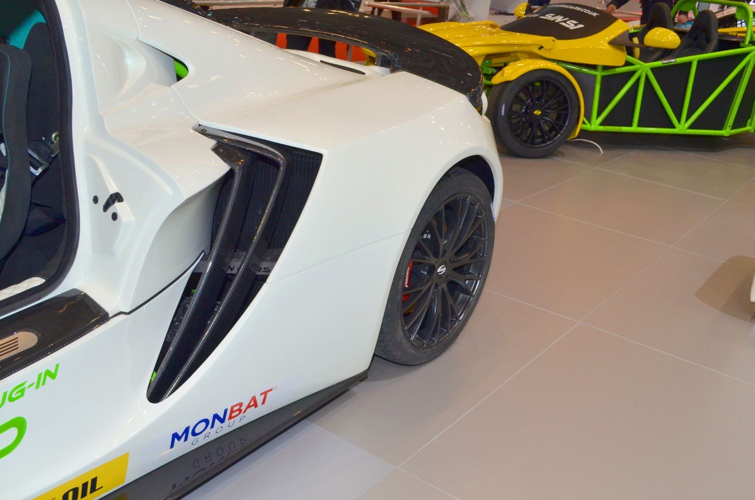 Aerodynamic rear fender and black multi-spoke wheel of sports car
