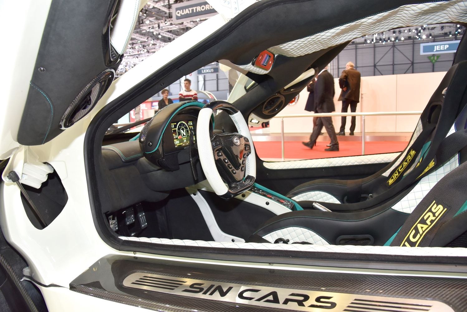 Sports car cockpit with racing seats and unique steering wheel