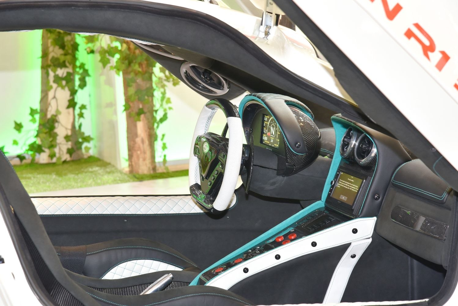 Luxury sports car interior with advanced steering wheel and digital display