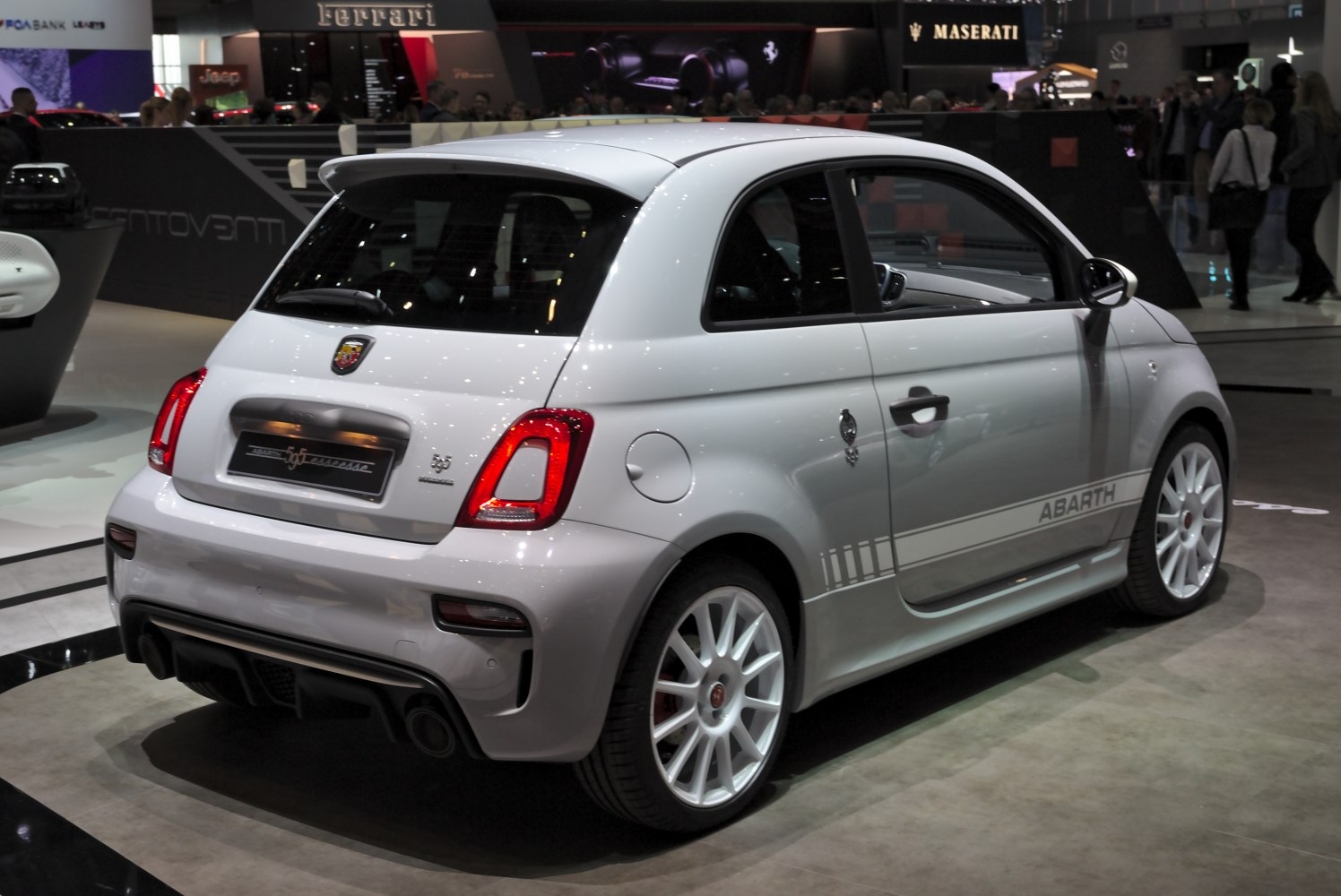 Rear side view of a white sporty hatchback with distinctive lights