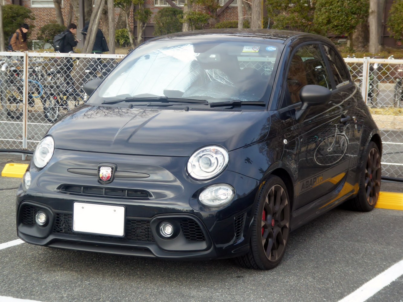 Compact hatchback front with round headlights and sporty bumper