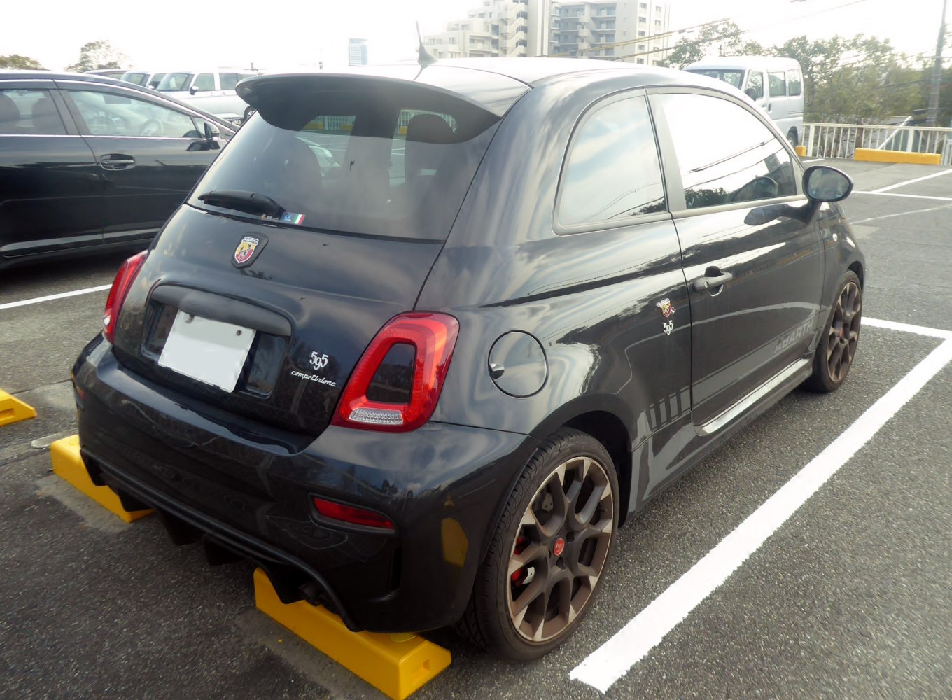 Rear and side view of sporty hatchback with distinct taillights and alloy wheels