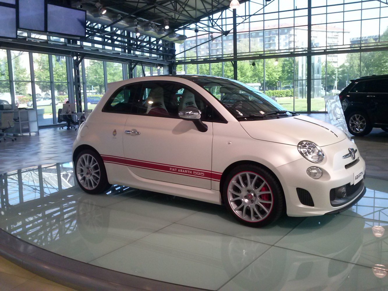Compact hatchback with sporty alloy wheels and red brake calipers