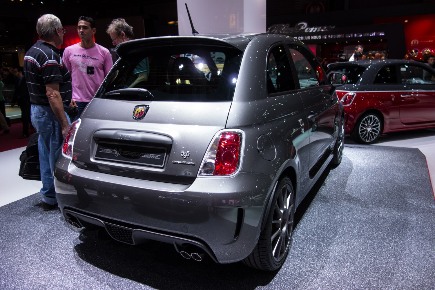 Rear view showing dual exhaust and distinctive taillights on sporty hatchback