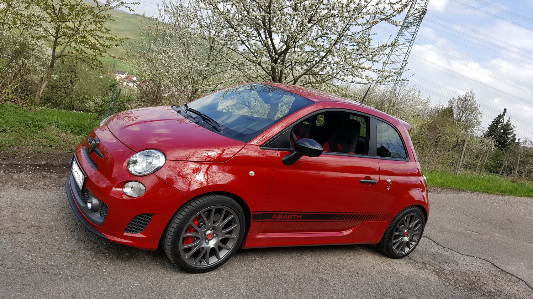 Compact sporty hatchback with alloy wheels and red brake calipers