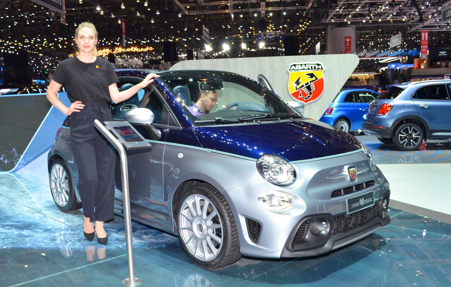 Metallic two-tone compact hatchback with sporty design and distinctive front fog lights