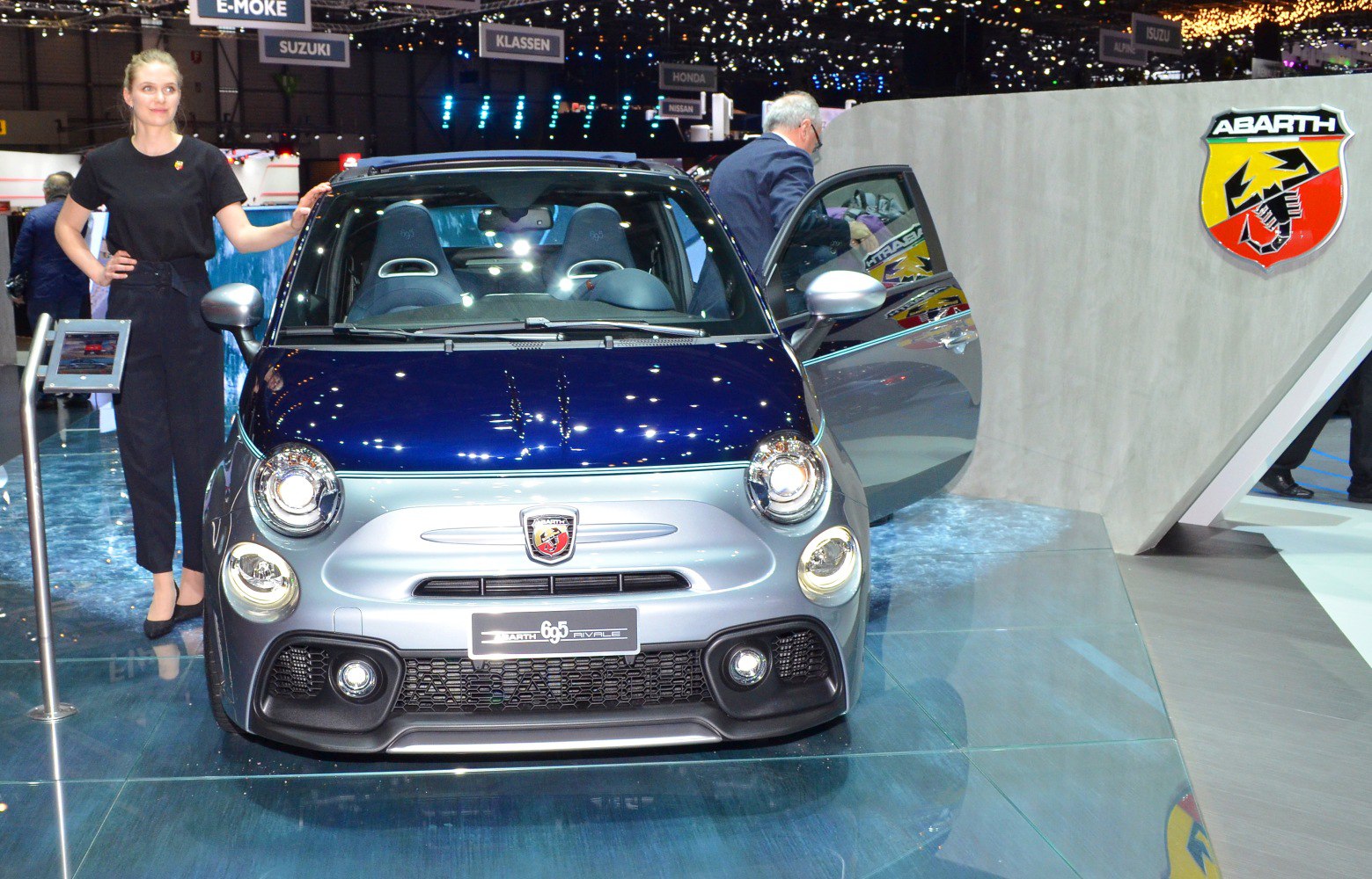 Front view of compact car with round headlights and sporty grille