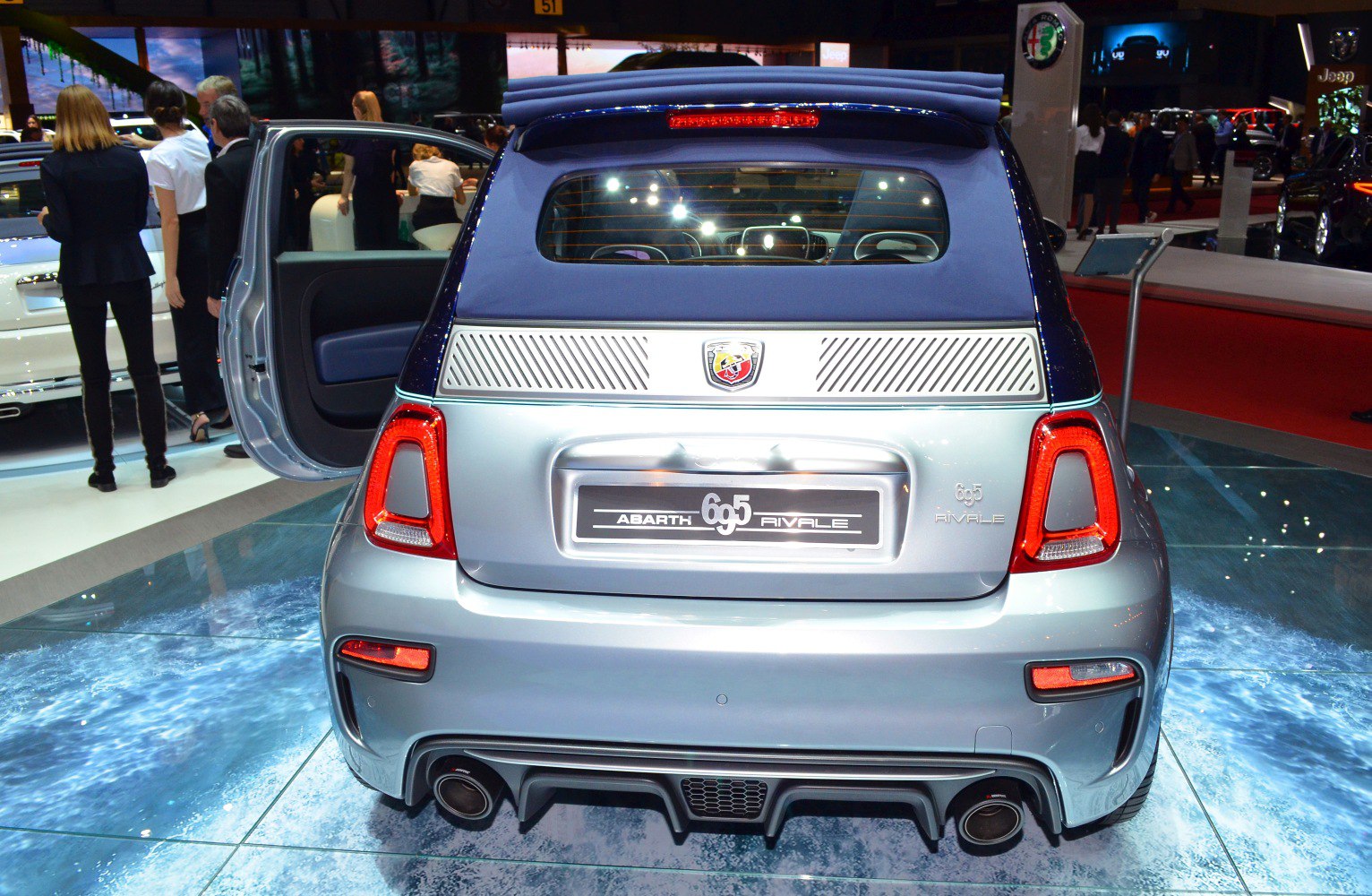 Compact hatchback rear with dual exhaust and convertible soft top roof