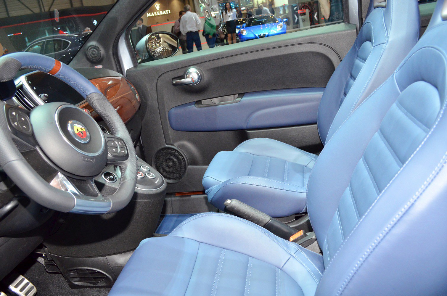 Blue leather seats and modern steering wheel