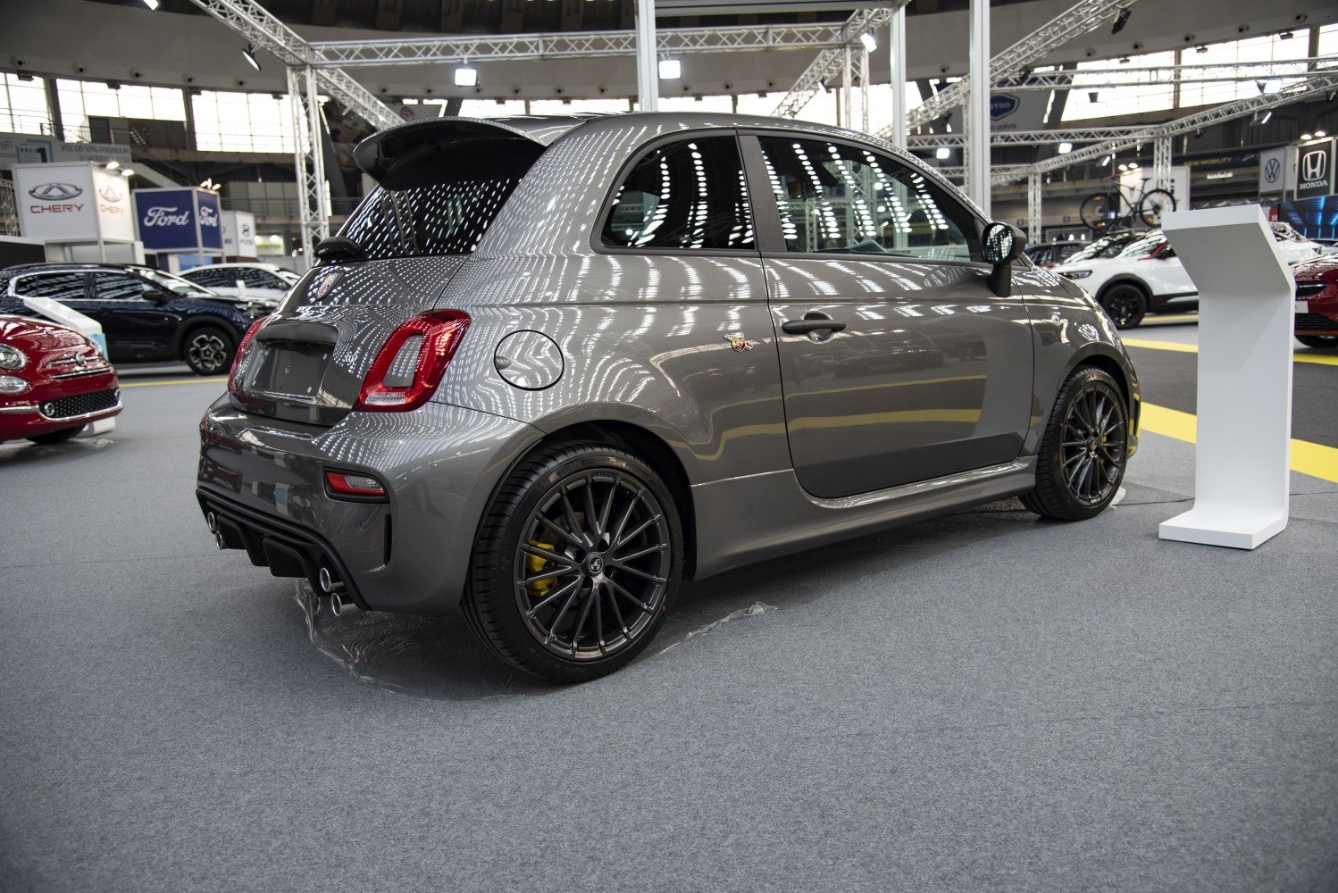 Sporty rear and side view of compact hatchback with alloy wheels