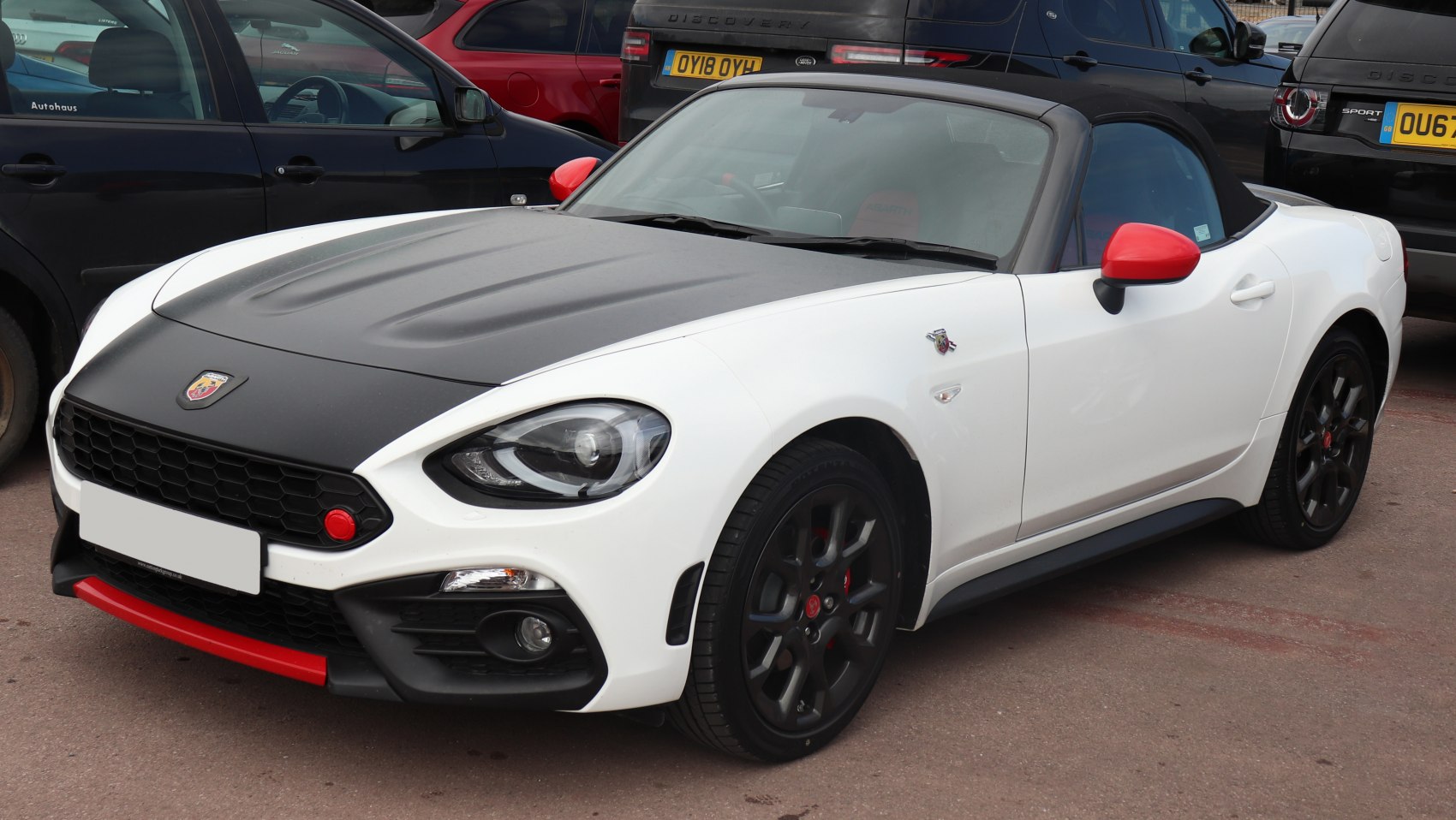 Convertible front with matte black hood, red accents, black wheels