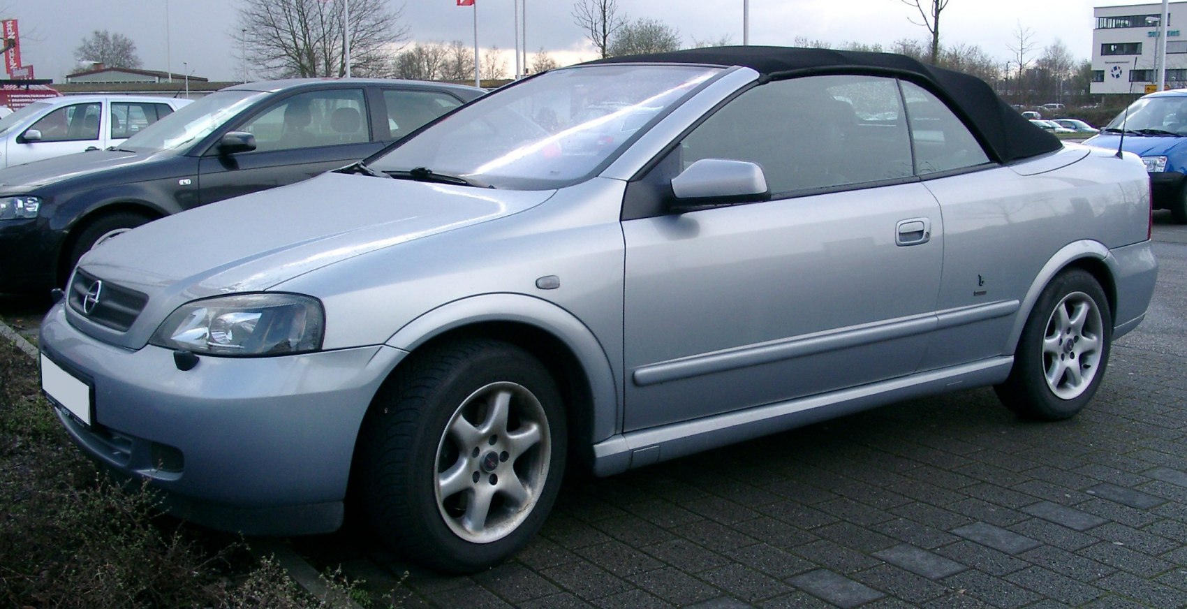 Silver convertible with soft top and alloy wheels