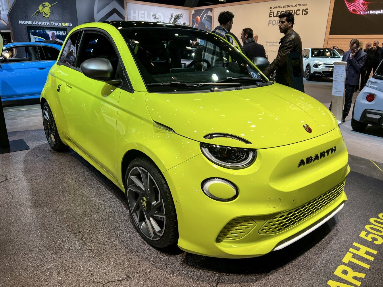 Bright yellow electric hatchback with aerodynamic design and sporty wheels
