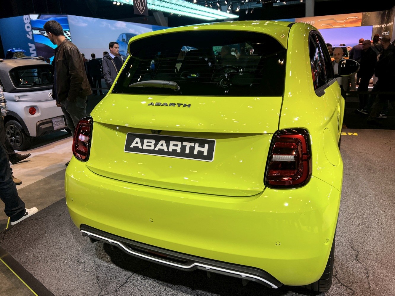 Rear view with distinct taillights and Abarth badge on compact electric hatchback