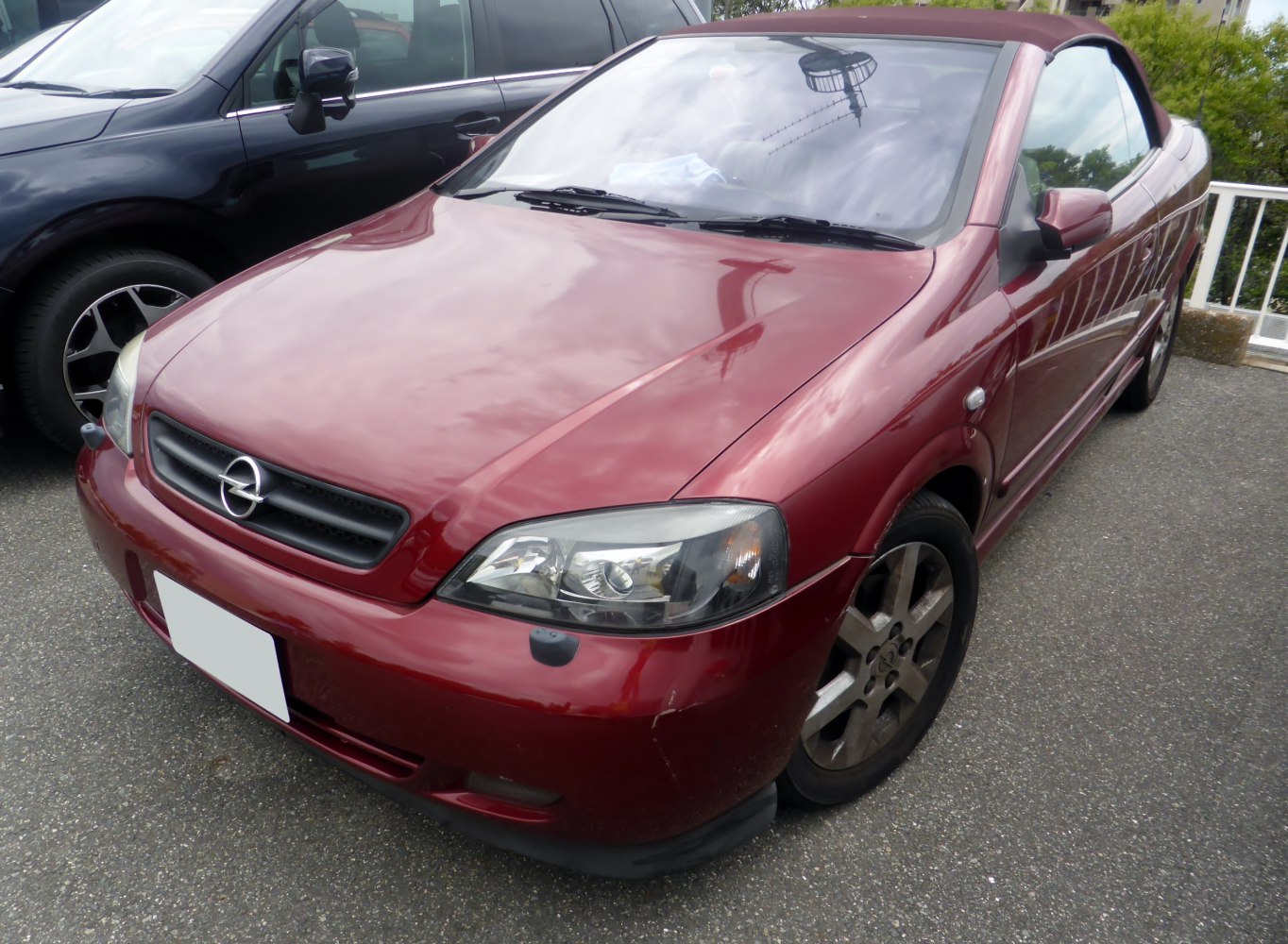 Front view of convertible with closed soft top and clear headlights