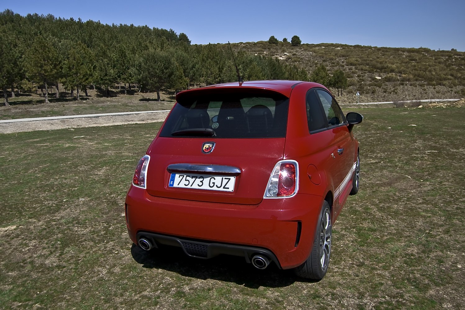 Sporty compact hatchback rear with dual exhaust and taillights