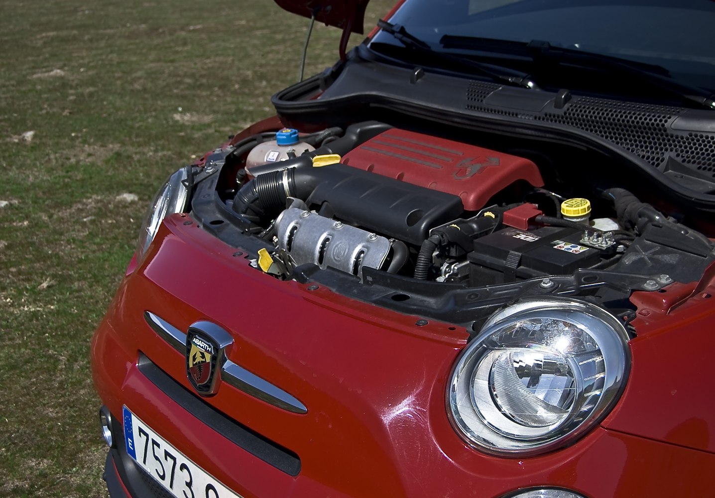 Close-up of compact engine bay and front round headlight