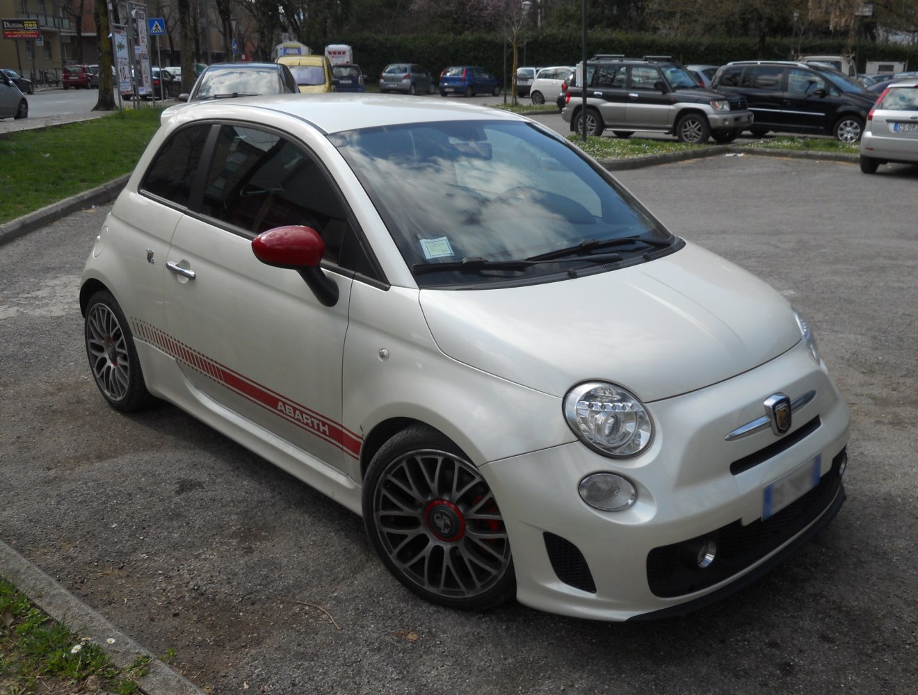 Compact sporty hatchback with red side decals and alloy wheels