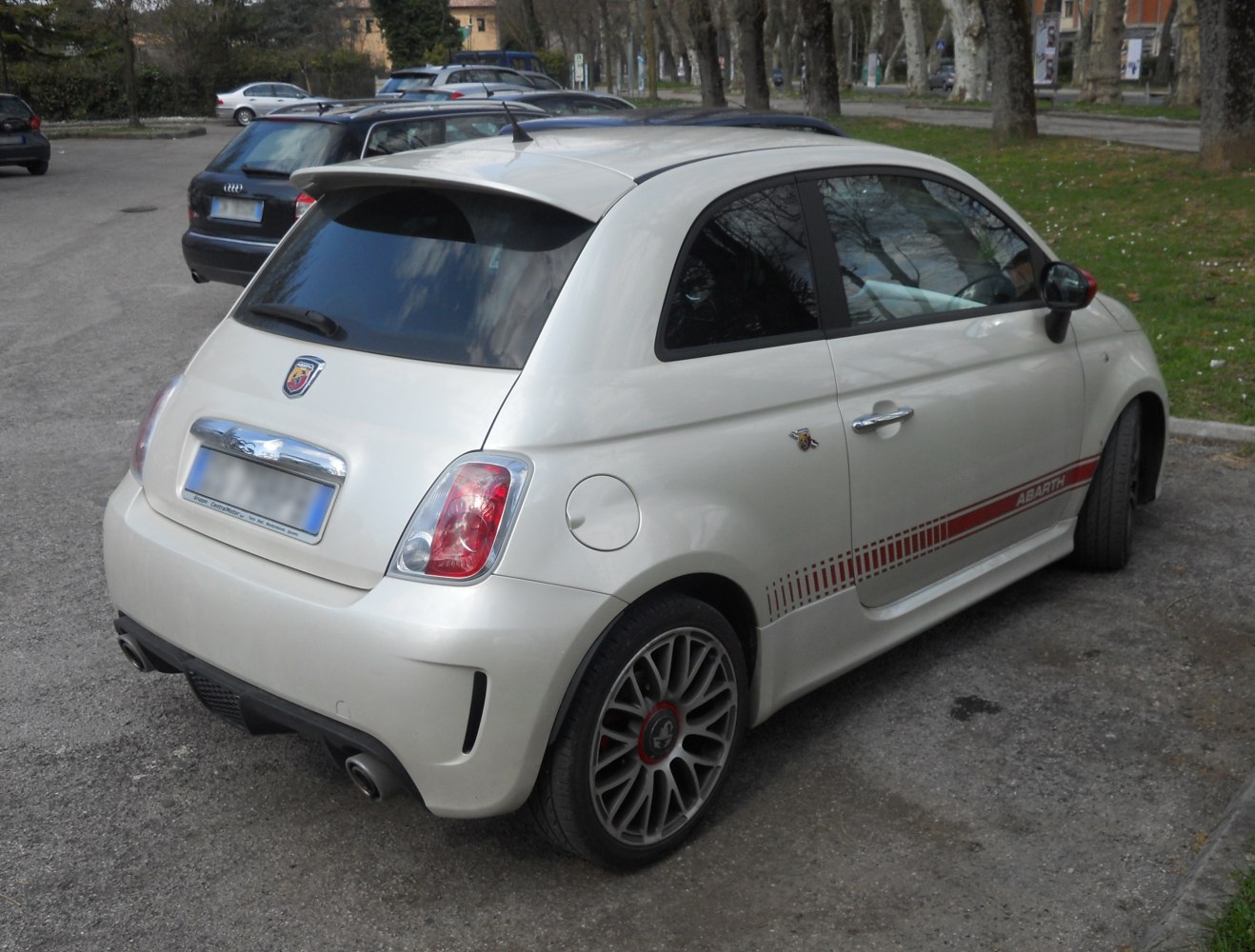 Small hatchback with rear spoiler and sporty alloy wheels