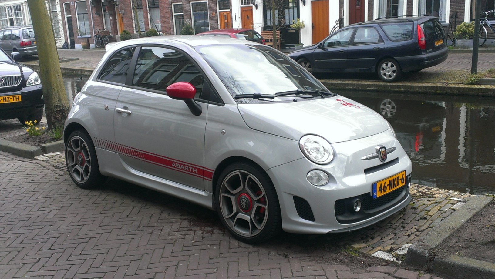 Sporty compact hatchback with red stripes and custom wheels