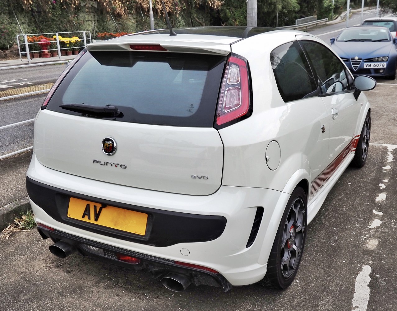 Rear view of sporty hatchback with dual exhaust and rear spoiler