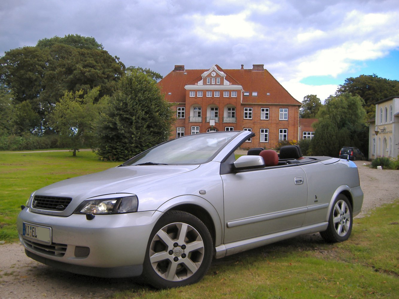 Silver convertible with alloy wheels and headlights