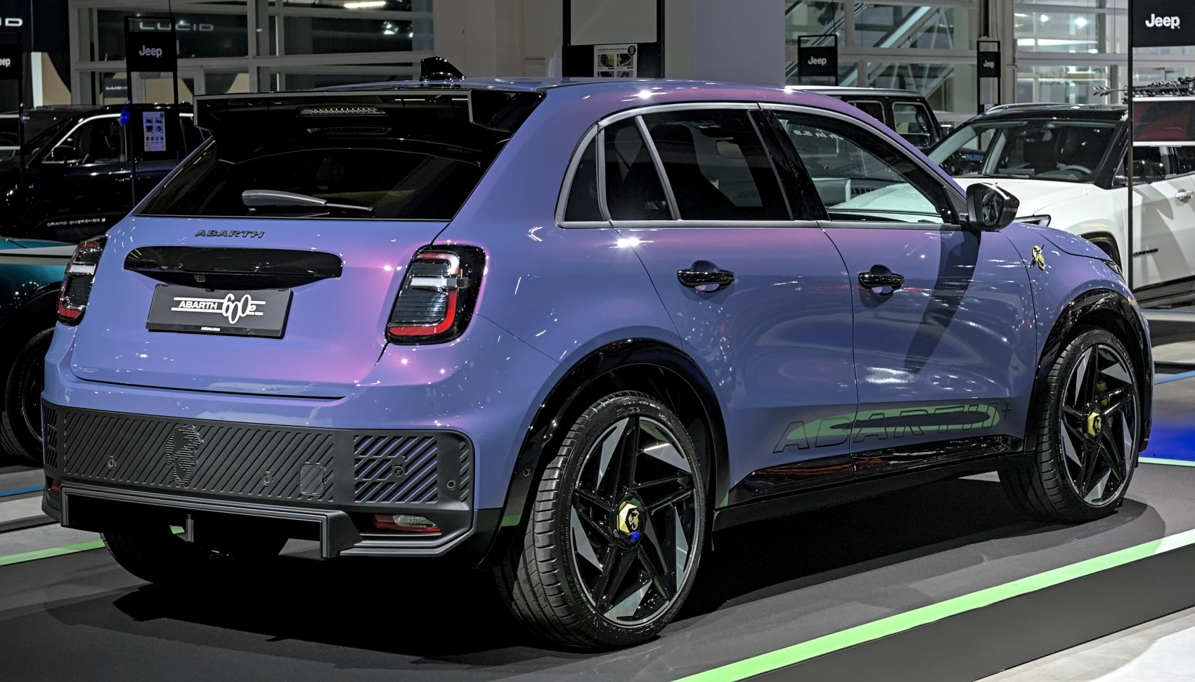 Rear and side profile of a sporty electric crossover with distinctive alloy wheels