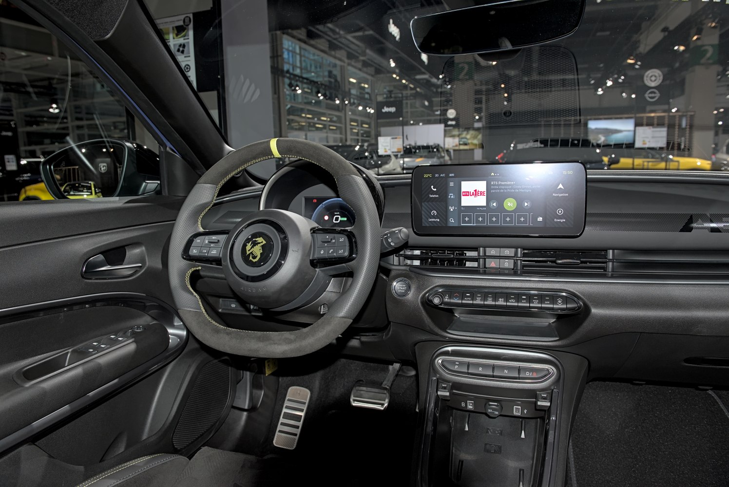 Sporty steering wheel and advanced digital dashboard with infotainment system