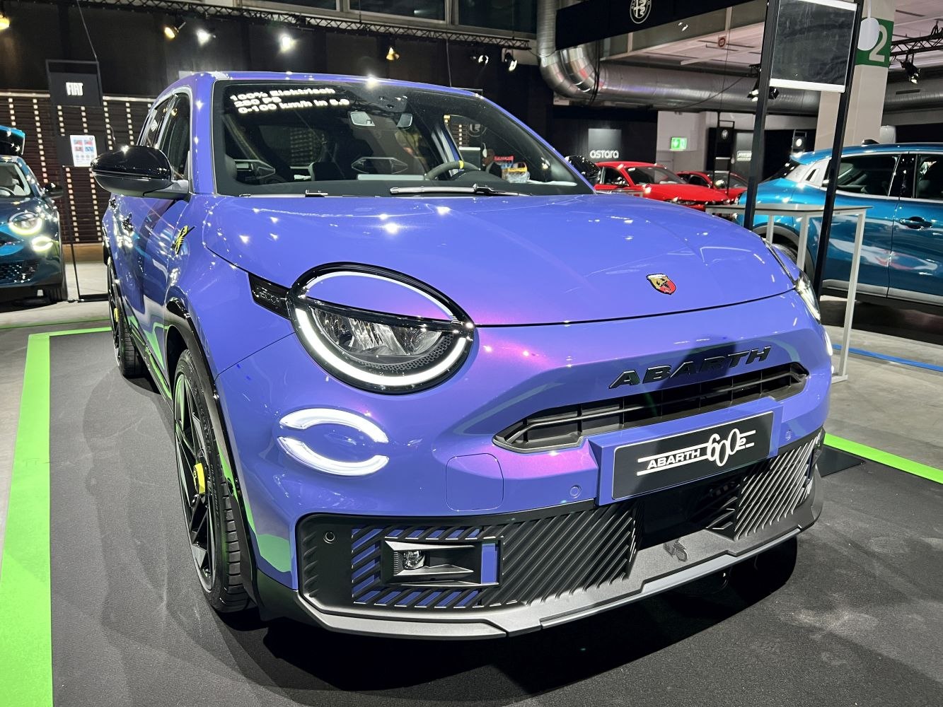 Front view with circular LED headlights and sporty grille