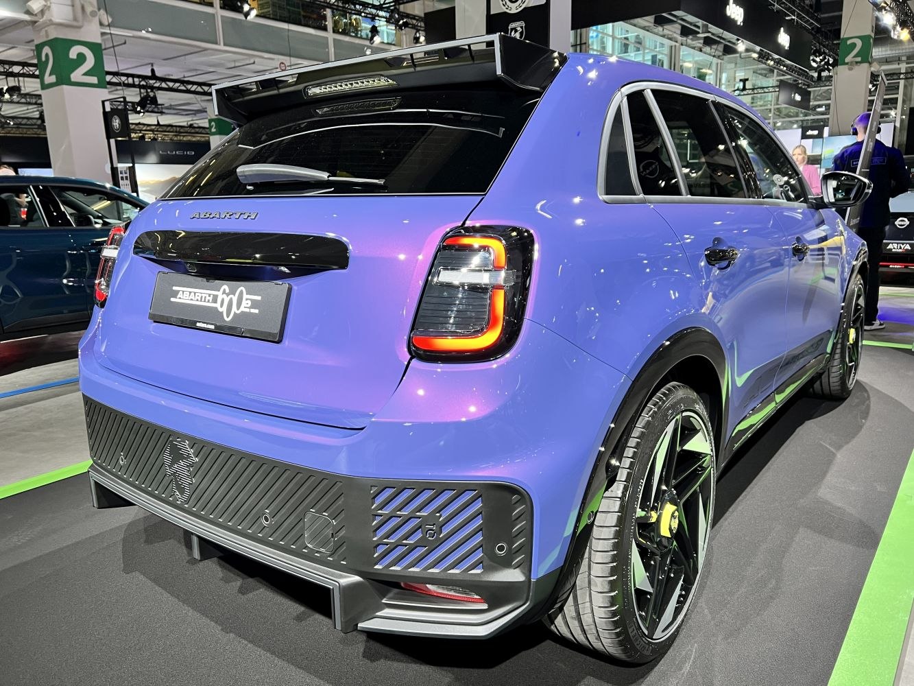 Rear view of a sporty electric hatchback with LED tail lights and diffuser