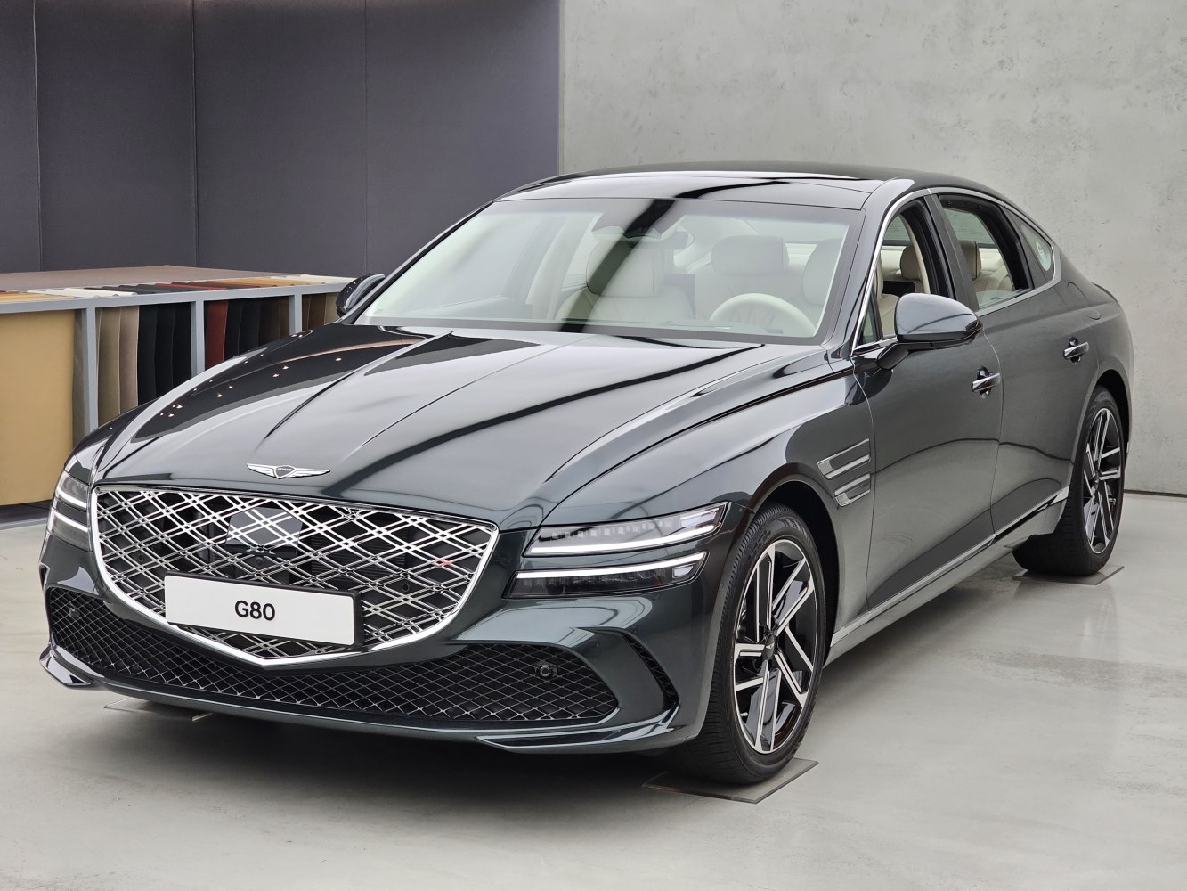 Luxury sedan with diamond-pattern grille and sleek LED dual headlights