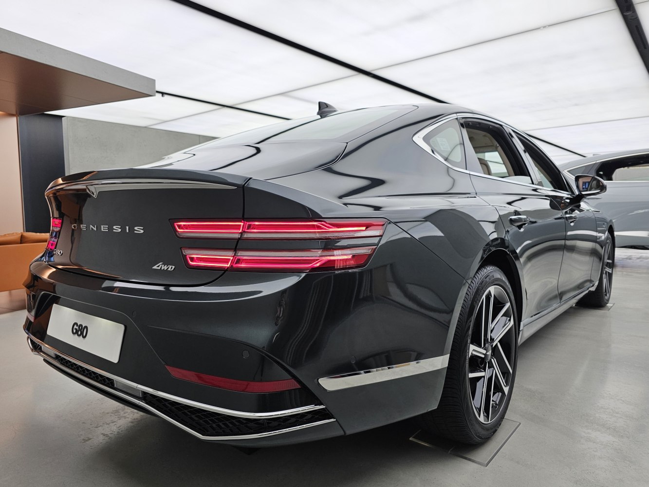 Rear and side view with distinctive taillights and alloy wheels