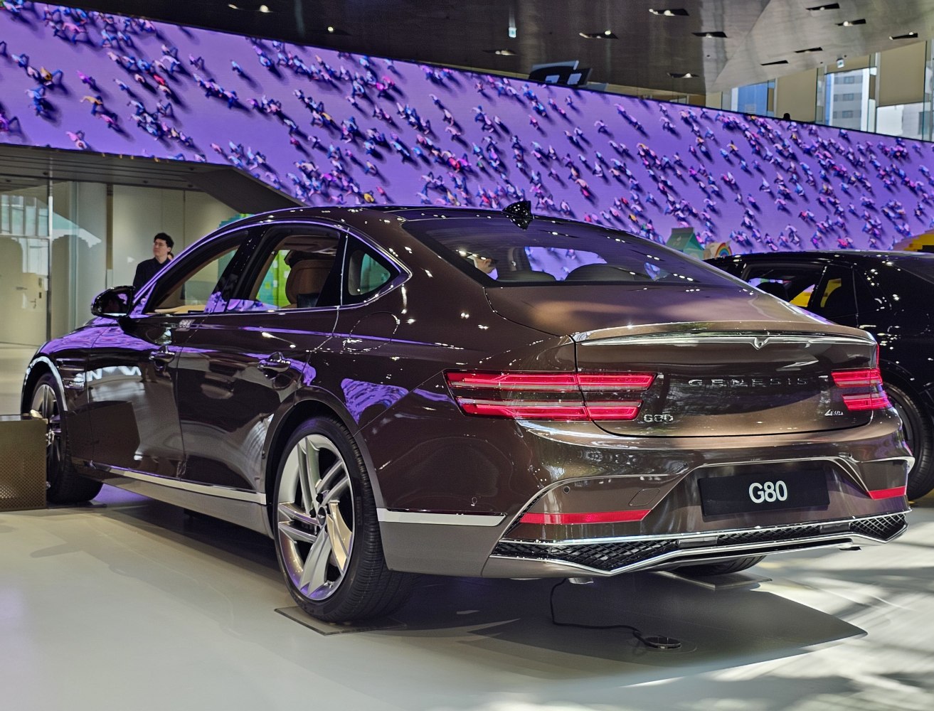 Sleek rear design with modern tail lights and alloy wheels.
