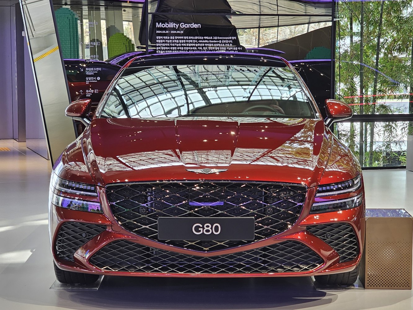 Front view with distinctive grille and LED headlights of luxury sedan