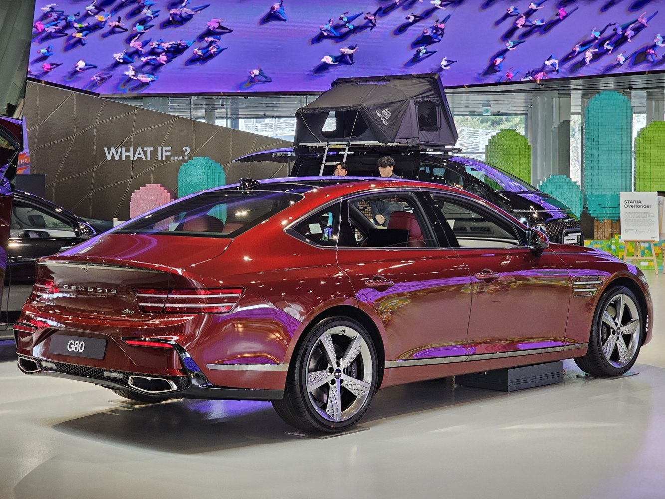 Luxury sedan rear view with LED tail lights and stylish alloy wheels