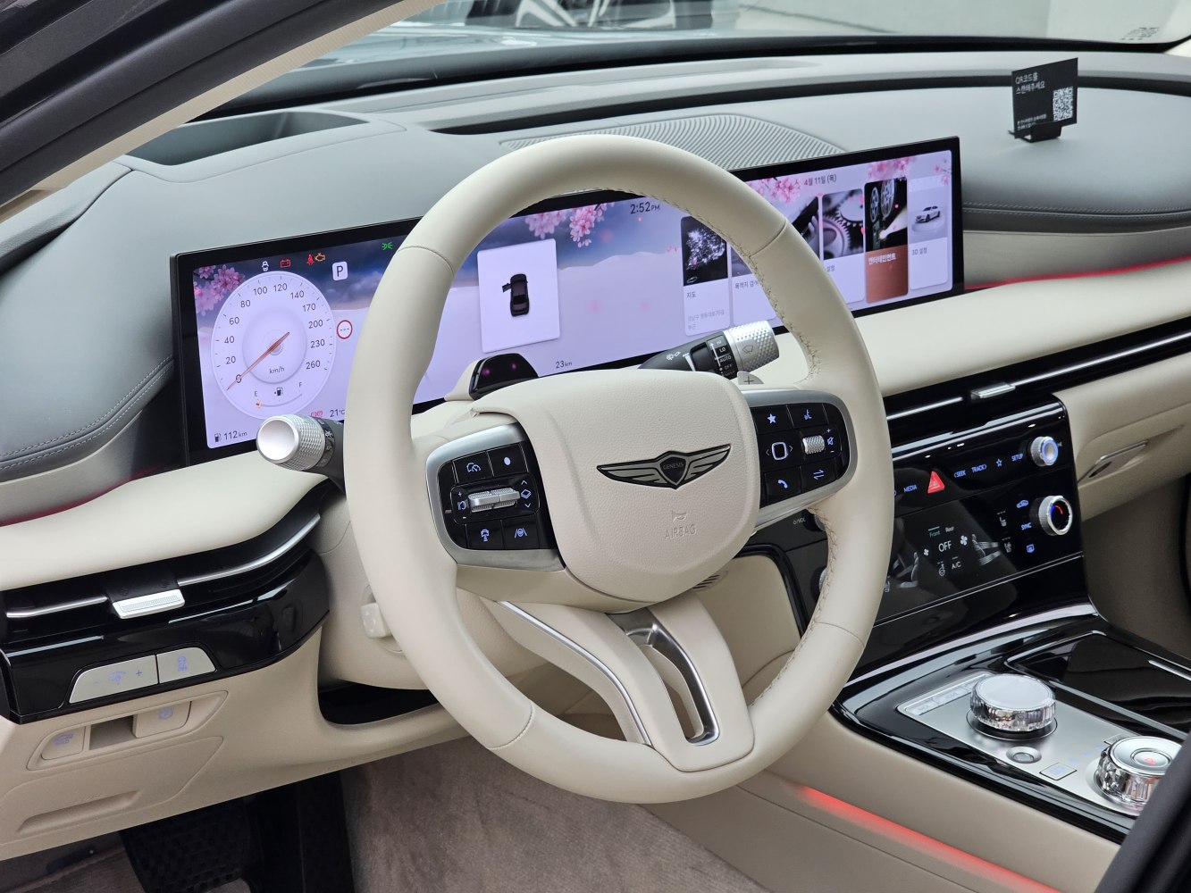 Digital instrument cluster and multifunction steering wheel in luxury car interior