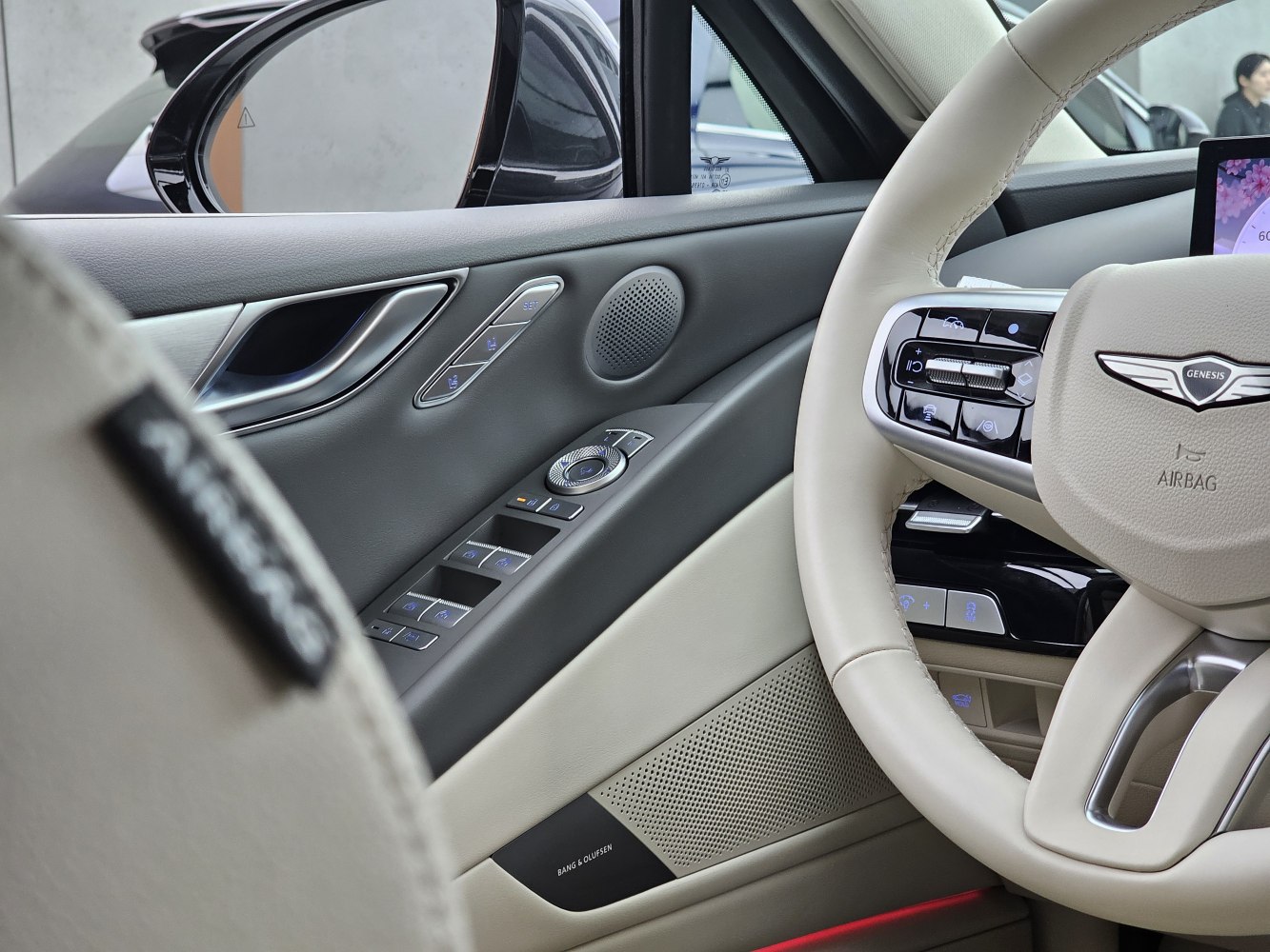 Steering wheel and door panel controls with sound system branding