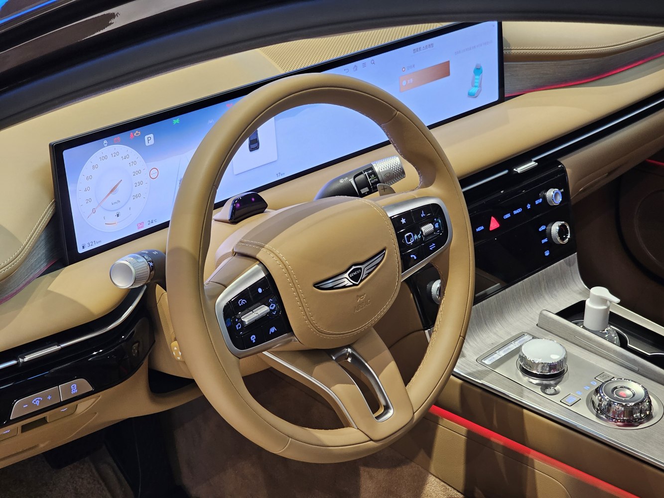 Dashboard and steering wheel with digital instrument cluster and infotainment controls