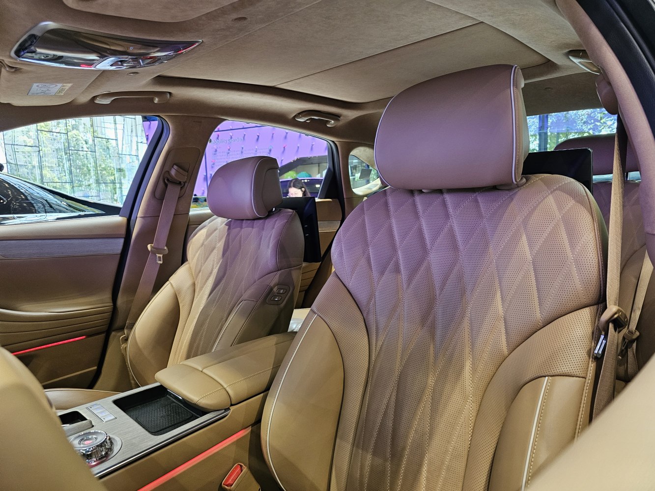 Luxury interior with diamond-stitched leather seats and advanced controls.