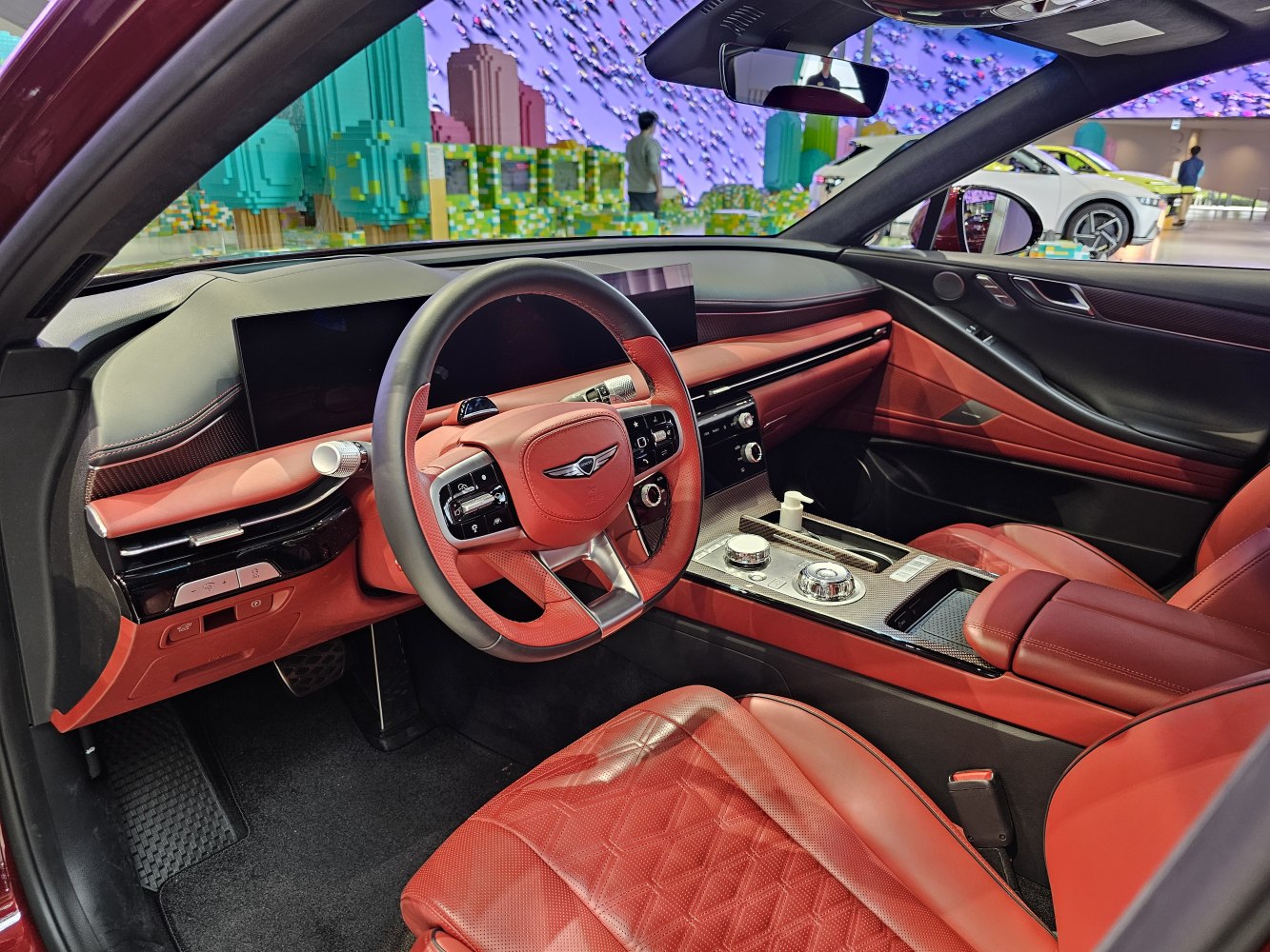 Red leather luxury seats with advanced digital dashboard and control center