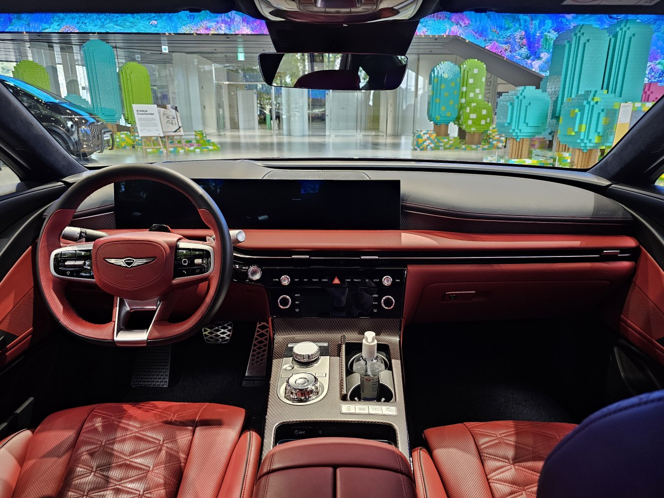 Premium red leather interior with digital dashboard and advanced controls.