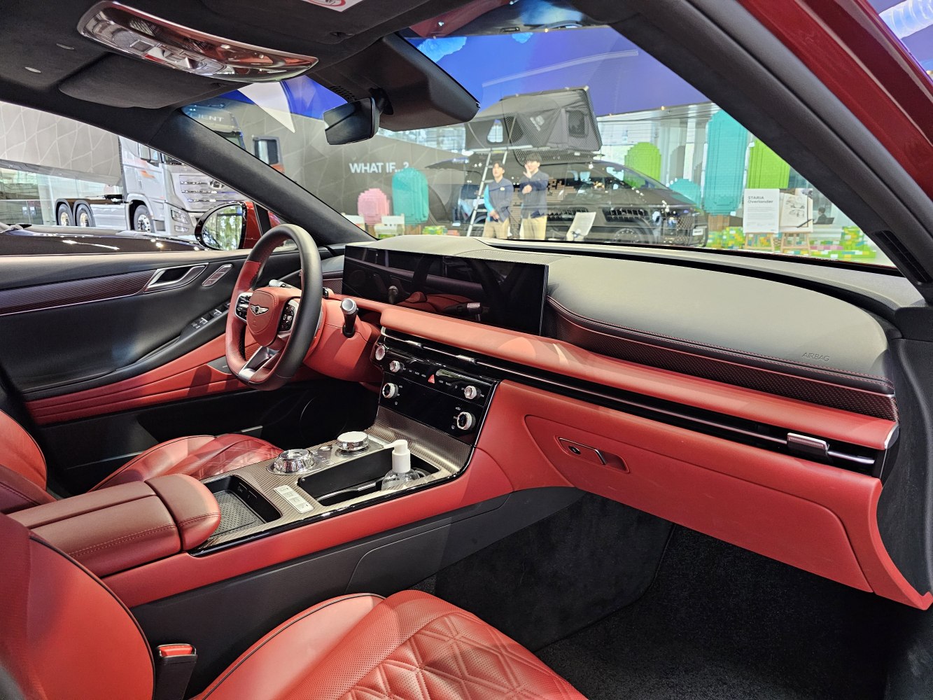 Red leather interior with digital dashboard and modern steering wheel