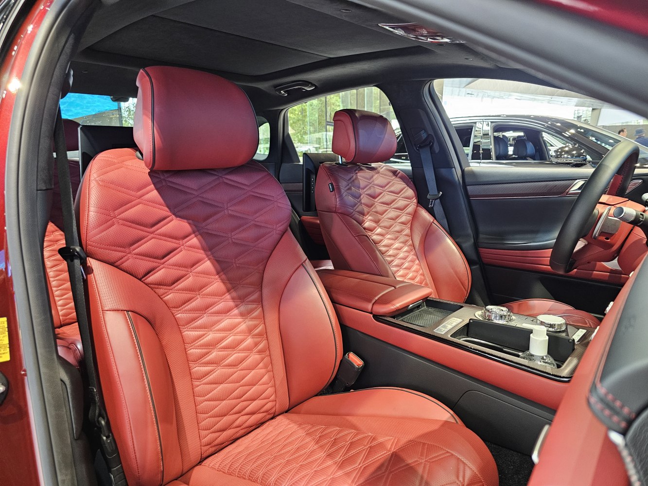Red quilted leather seats with detailed stitching and center console