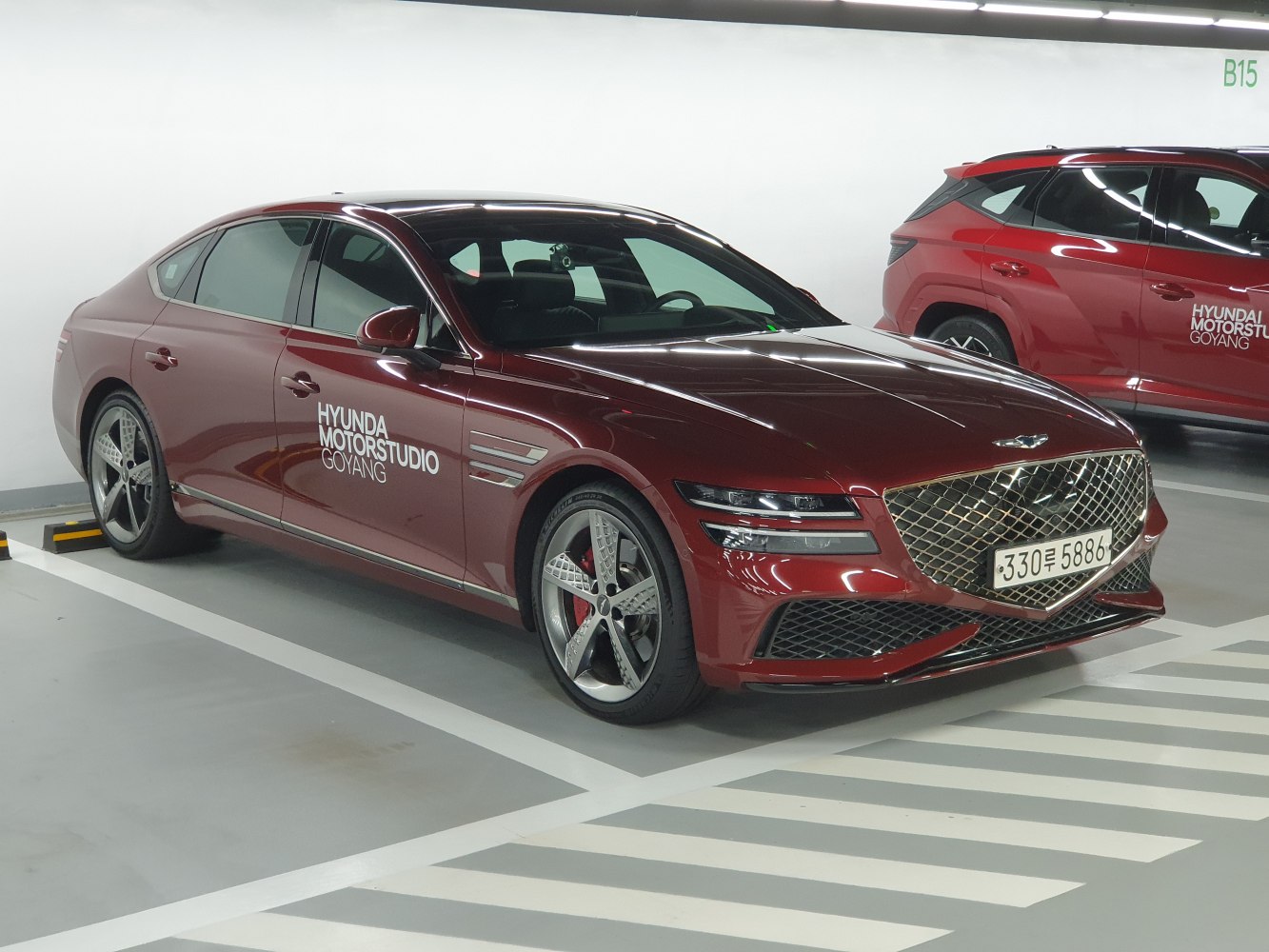 Luxury sedan with large mesh grille and LED dual headlights