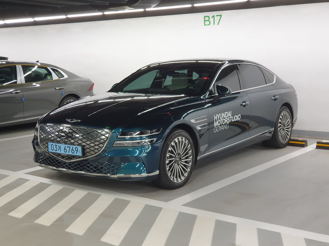 Luxury sedan with distinctive front grille and multi-spoke alloy wheels