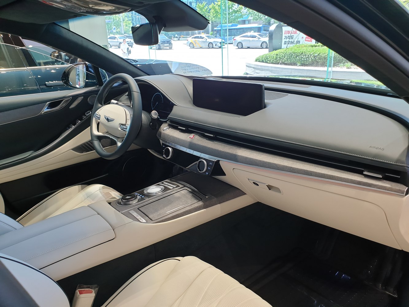 Luxury interior with digital display and rotary control dial.