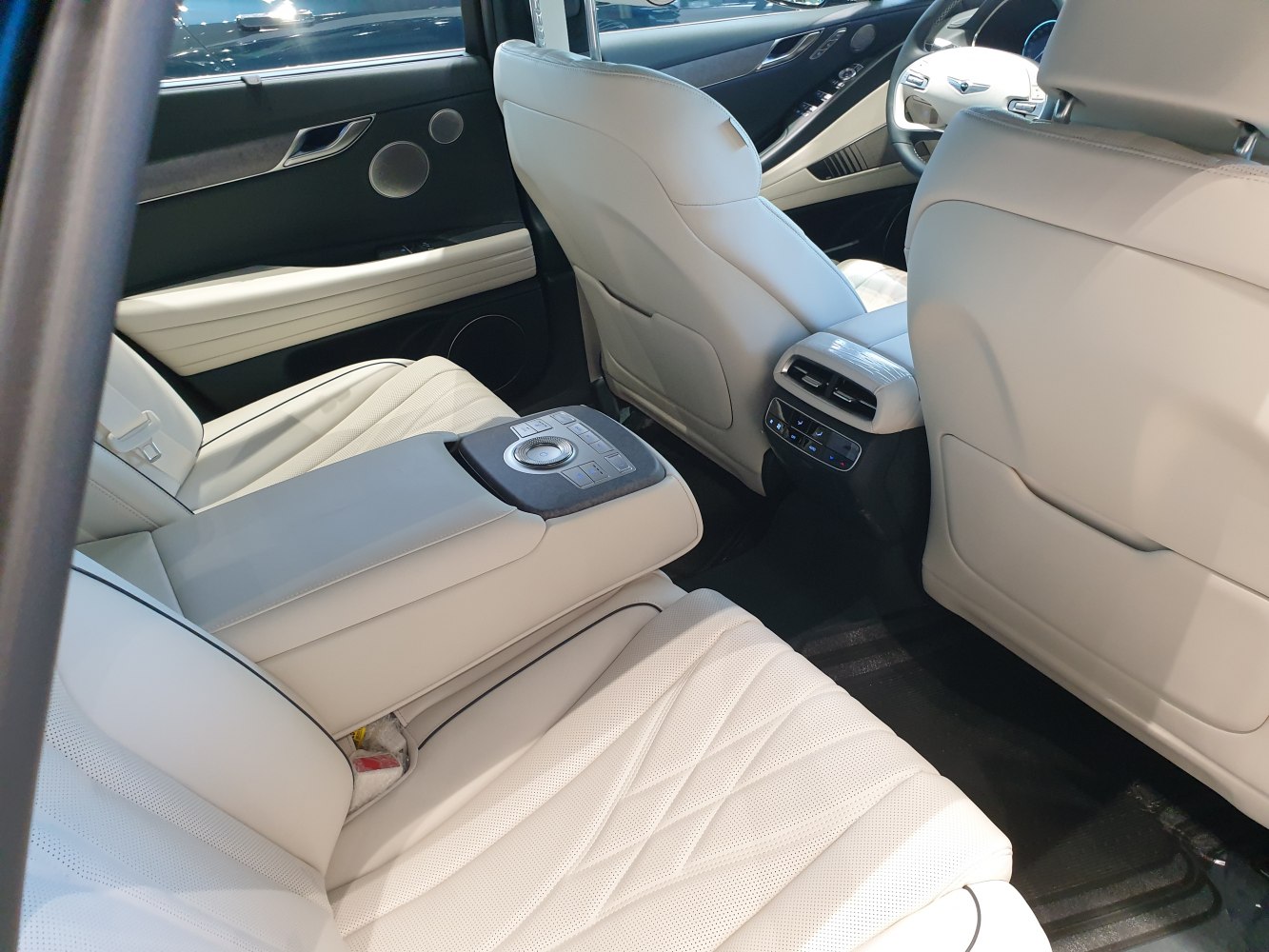 Luxurious rear interior with leather seats and integrated control panel